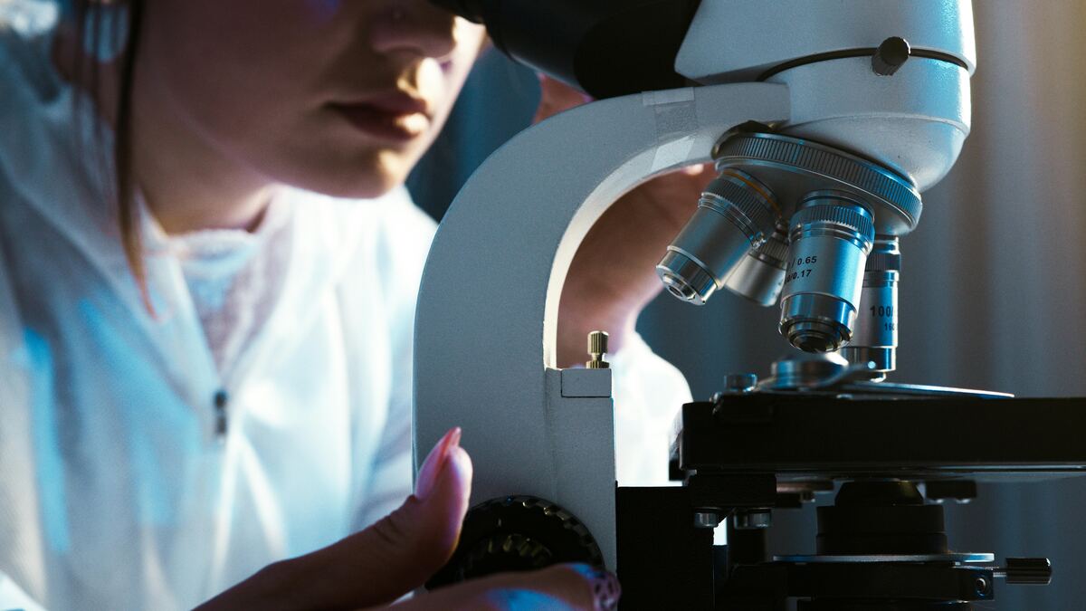 Scientist at microscope